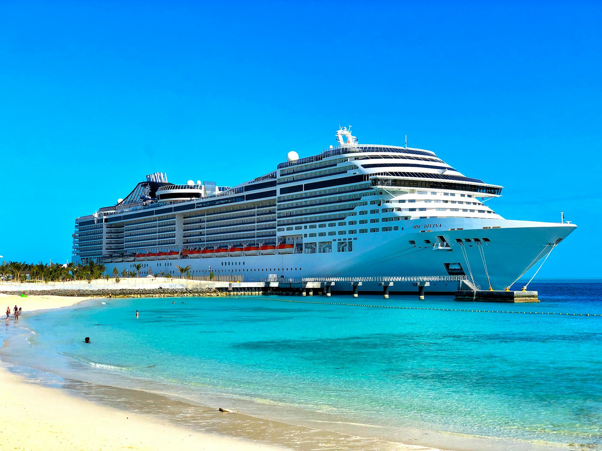 Modern cruise ship docked at port ready for departure